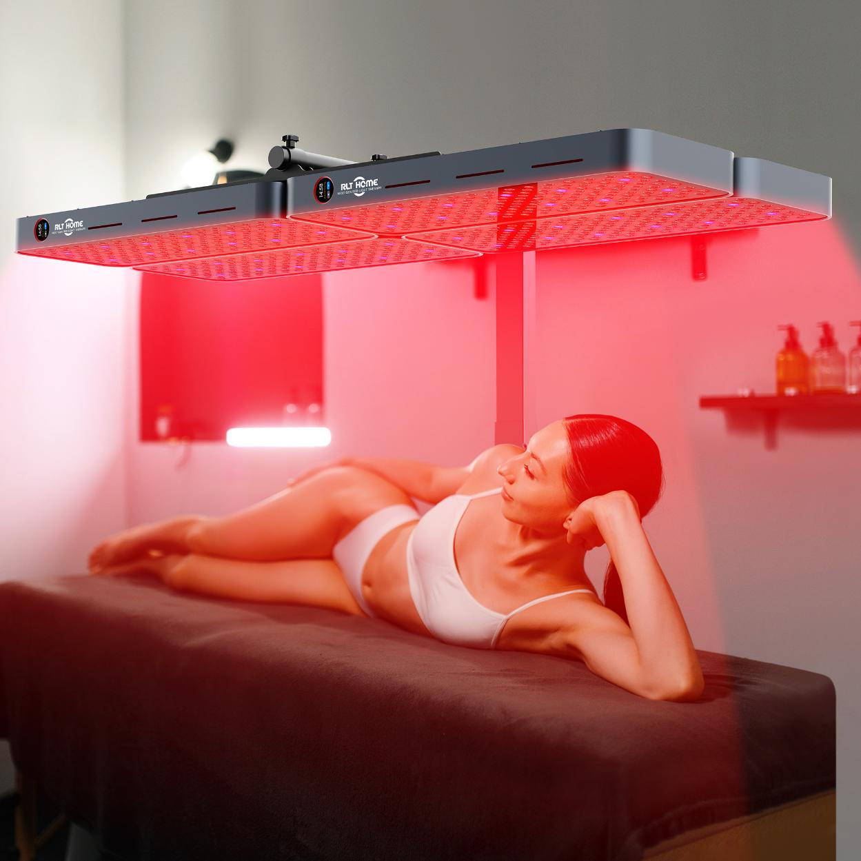 Woman lying under an RLT Home multi-panel setup on a motorized electric stand for full-body coverage